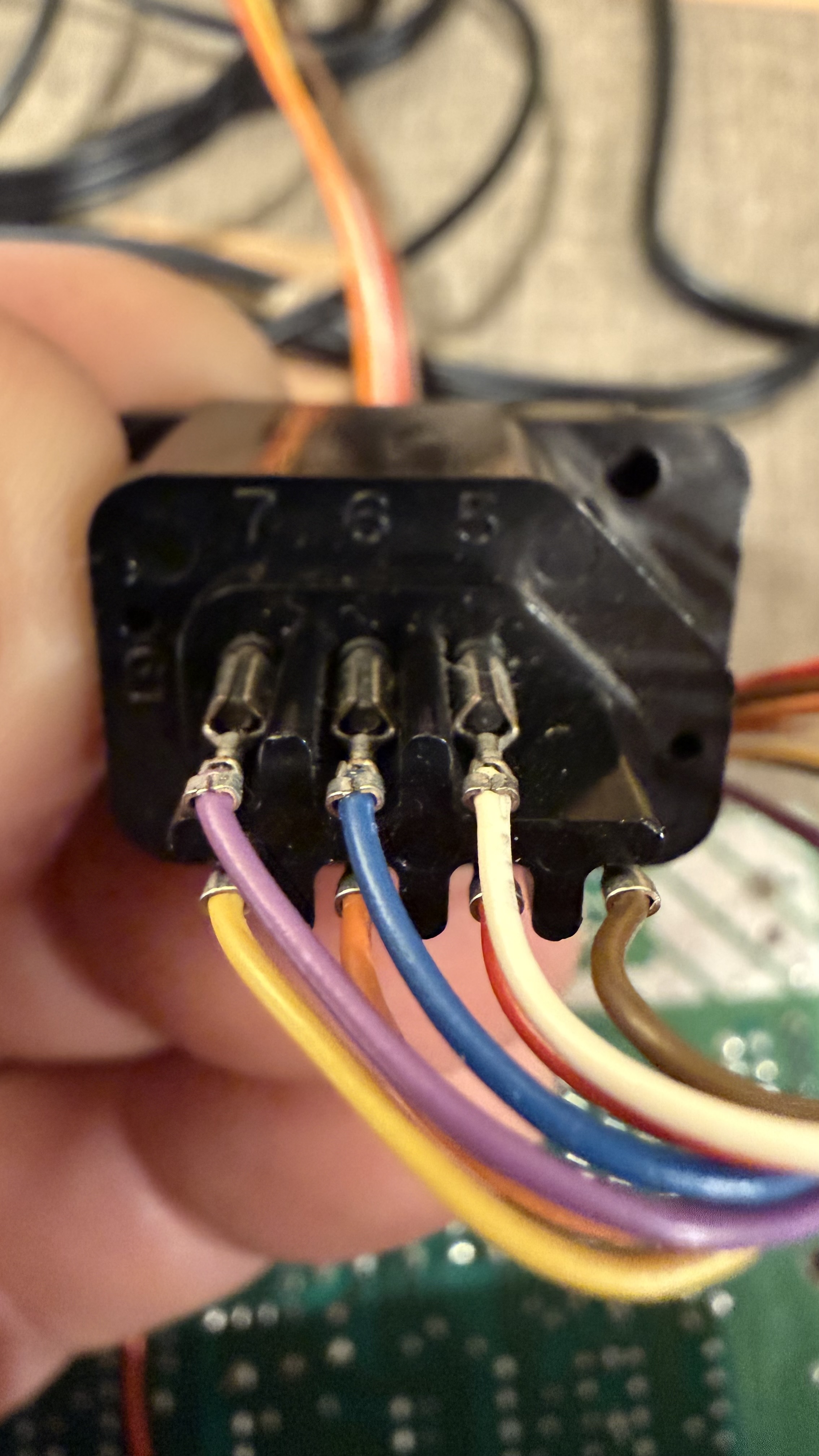 The controller harness's colours against the port's pins
